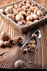 Mixed nuts on a wooden background