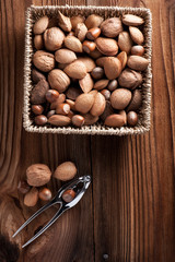 Mixed nuts on a wooden background