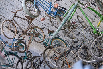 Many colorful Bicycles stanging in a row - 94285503