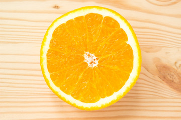 Sliced orange on wooden background