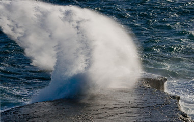 Naklejka premium The coastline on the Peninsula Valdes. Argentina. An excellent illustration. Waves crashing against the rocks.
