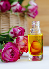 Obraz na płótnie Canvas Cosmetic aroma oil with rose essence