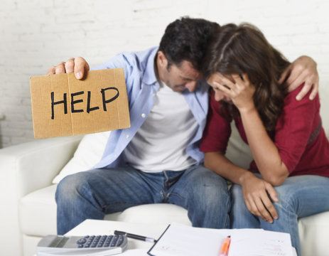 young couple worried at home in bad financial situation stress asking for help