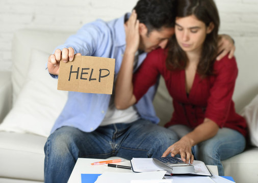 young couple worried at home in bad financial situation stress asking for help