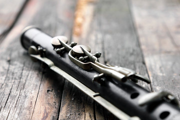 Old silver flute on rusty wooden table