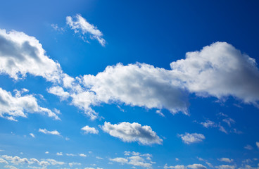 Naklejka na ściany i meble Blue sky with clouds in a summer day