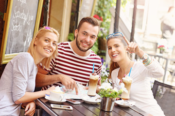 Group of tourists in the cafe