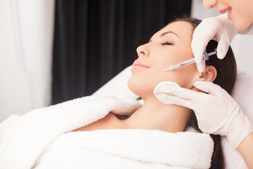 Beautiful healthy lady is visiting expert beautician