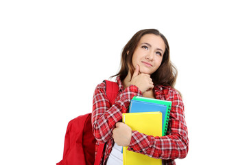 Fototapeta premium Portrait of a young student girl on a white background