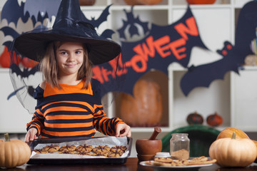 Little girl is preparing for halloween party