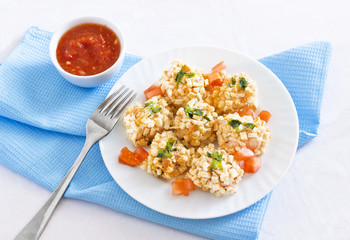 Breaded chicken breast with salad greens and oyster mushrooms