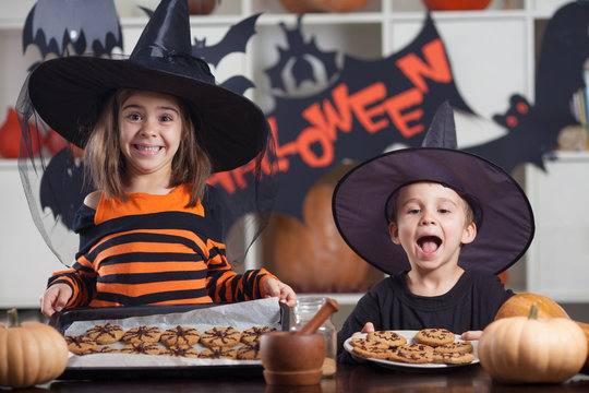 Kids Eating Halloween Coockies On A Party