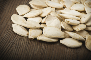 Dried pumpkin seeds on the wood table