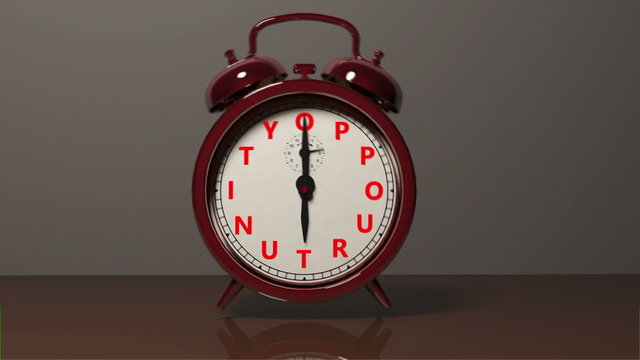 A red old fashioned type of Alarm Clock with letters spelling out "Oppourtunity" goes off and rings moving the alarm clock off its' feet.