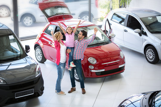 Excited Family Buying A New Car