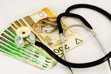 Banknotes and stethoscope