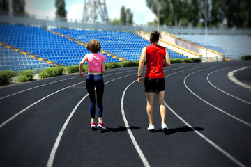 Obraz premium Young people jogging on stadium