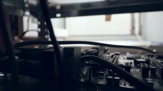 Inside the computer motherboard and hard disk in slowmotion with