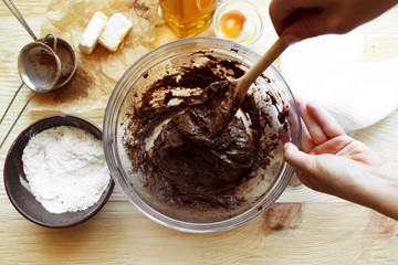 Preparing dough for chocolate pie on table close up
