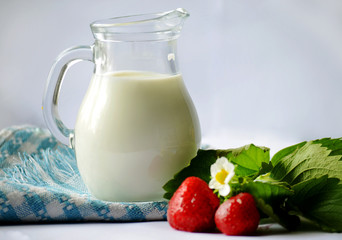 milk and strawberries on a white background