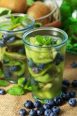 Kiwi and Blueberry cocktails on bright background