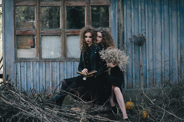 Two vintage witches gathered eve of Halloween