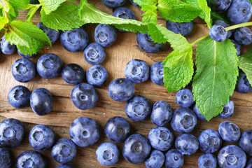 Fresh blueberries on wooden table, closeup