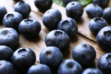 Fresh blueberries on wooden table, closeup