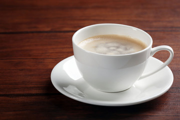 Cup of coffee on table close up