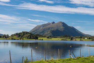 Typical Norwegian landscape Mountain, village, fjord