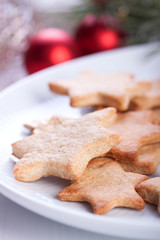 Homemade christmas cookies on white plate .