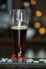 Cold beer glass on bar or pub desk