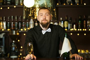 Portrait of handsome bartender at  work