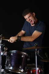 Drummer on dark background