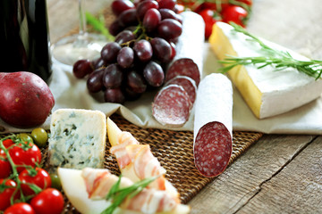 Still life with various types of Italian food and wine