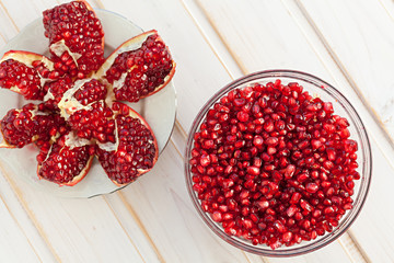 juicy pomegranate seeds in a glass bowl