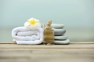 Beautiful spa composition with towels outdoors