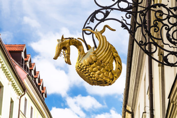Fototapeta na wymiar dragon sign figure on street in old town