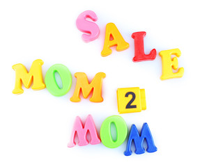 Concept of childish goods sale - magnetic plastic letters isolated on white background