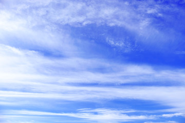 Blue sky with tiny clouds background