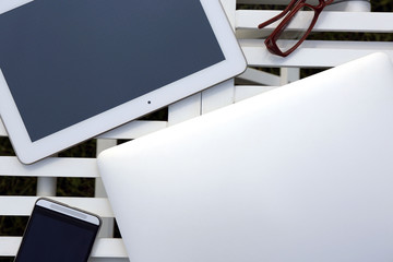 Gadgets on wooden table closeup
