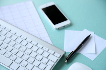 Medical still life with keyboard on blue table