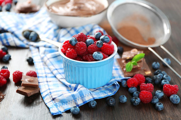 Beautiful composition with chocolate cream and ripe berries