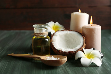 Spa coconut products on dark wooden background