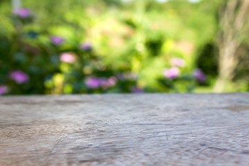 empty blurred wood table surface with green natural upcountry fresh view for background  