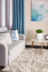 Sofa with colorful pillows in room