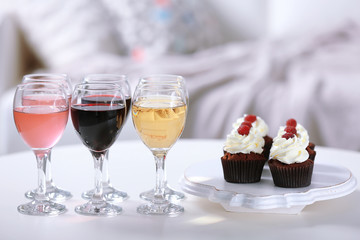Tasting of wine and chocolate cupcakes, close up