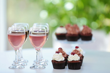 Tasting of wine and chocolate cupcakes, close up