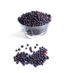 Bowl of frozen wild blueberries isolated on white background