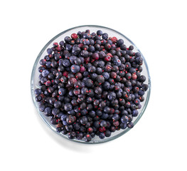 Bowl of frozen wild blueberries isolated on white background
